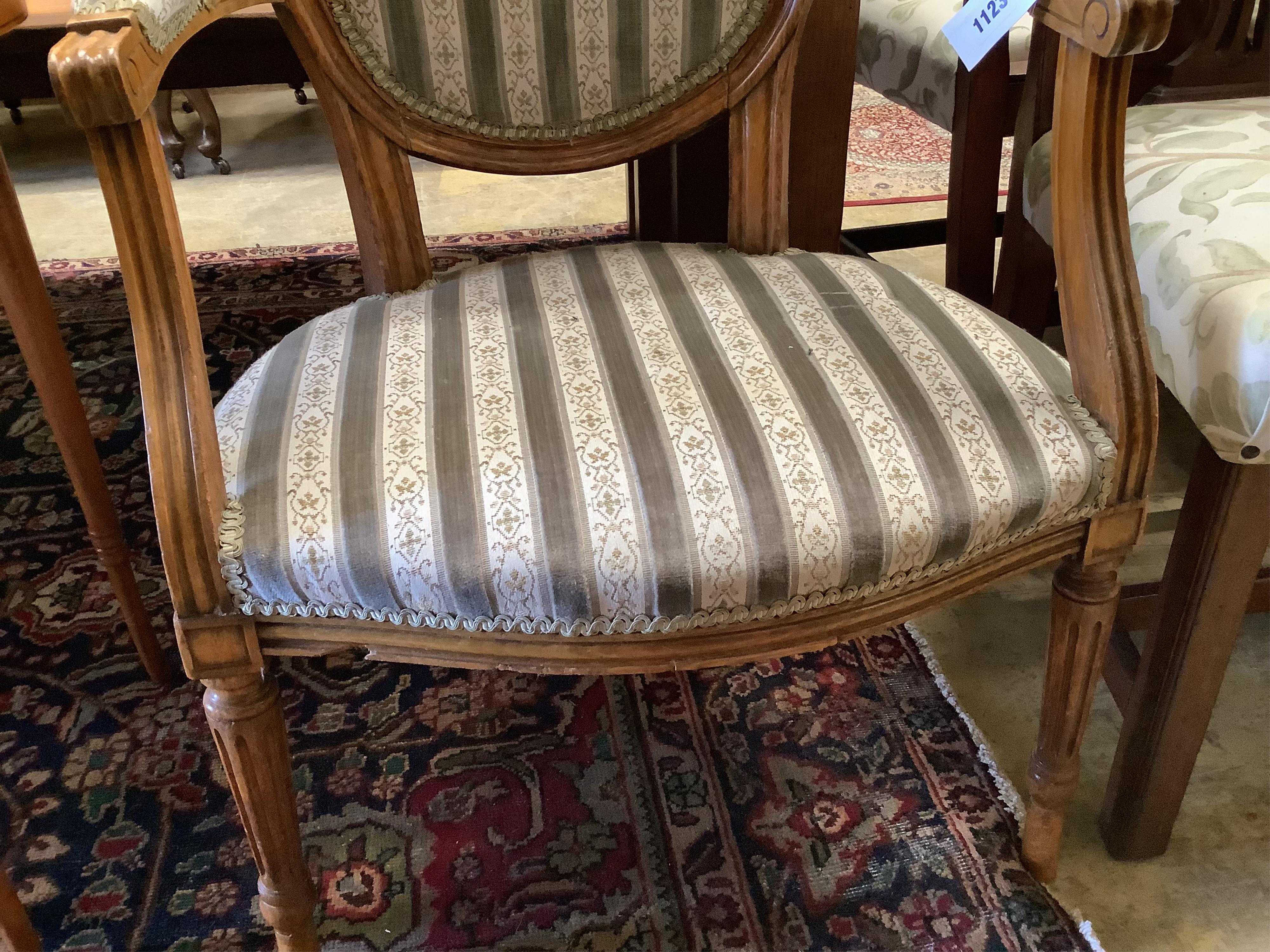 A Louis XVI design upholstered open armchair